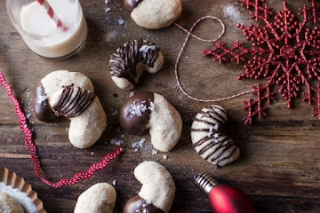 Chocolate Dipped Vanilla Bean Cashew Crescent Cookies.