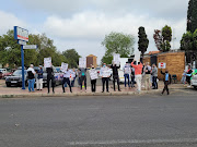 A silent protest taking place outside the Kempton Park magistrate's court on day one of the trial against the man accused of knocking down and killing cyclists Janine Hopkins and Frans Duys.