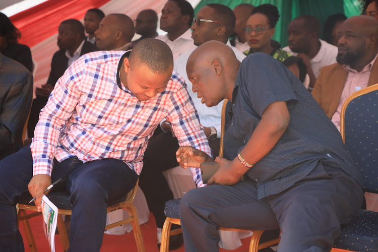 Wundanyi MP Dan Mwashako consults with his Voi counterpart Hamisi Chome in Taita Taveta county on July 23, 2023