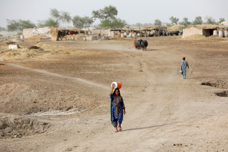 A woman carries water in Jacobabad, Pakistan. File photo: REUTERS