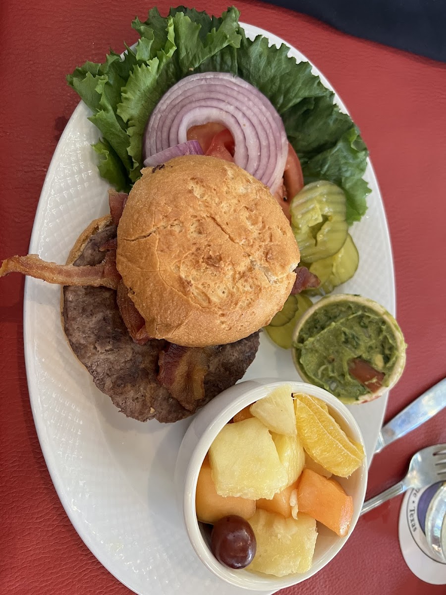 1/4 lbs burger with bacon and guac and a side of mixed fruit