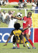 OUT OF SIGHT: Abia Nale of Kaizer Chiefs fight for the ball with Duncan Lechesa of Free State Stars during thier Absa Premiership at Olympia Stadium. 04/04/2009. Pic. Veli Nhlapo. © Sowetan.