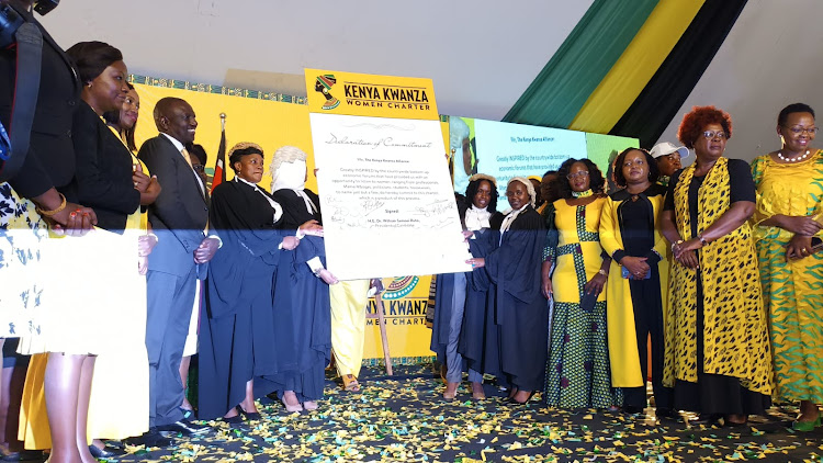 Kenya Kwanza Alliance flagbearer William Ruto among other leaders display a signed dummy of Kenya Kwanza Women Charter at Nyayo Stadium on June 10, 2022/ CHARLENE MALWA