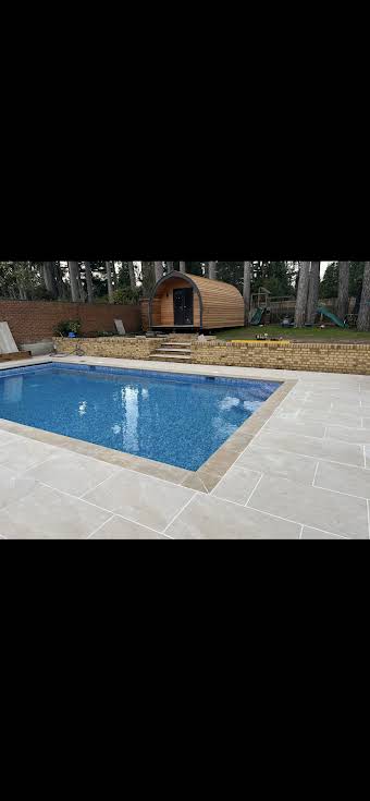 Retaining wall and patio area around pool. album cover