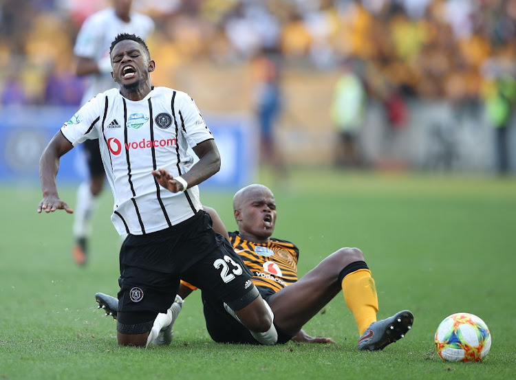 Innocent Maela of Orlando Pirates tackled by Willard Katsande of Kaizer Chiefs during the 2019 Telkom Knockout quarter final match between Kaizer Chiefs and Orlando Pirates at Moses Mabhida Stadium, Pietermaritzburg, on 2 November 2019.