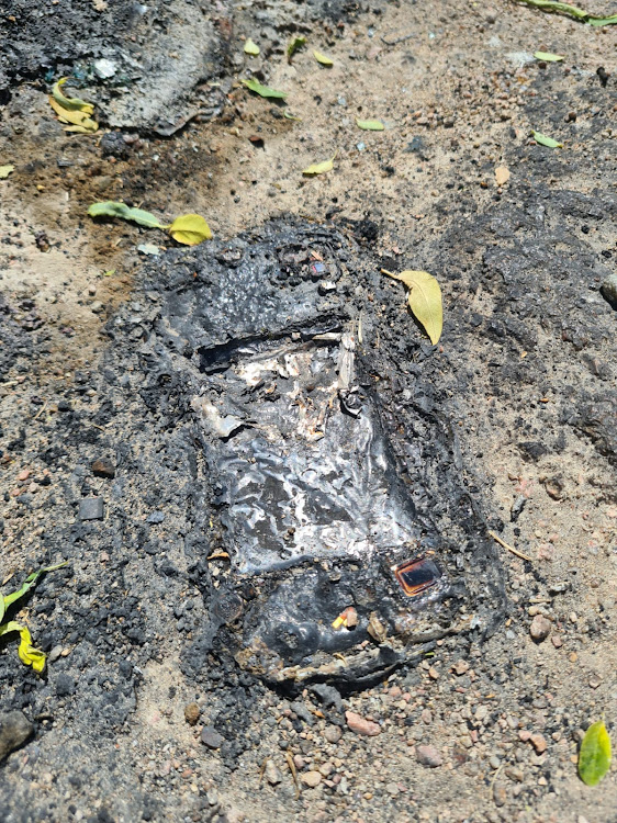 The blaze was so hot it melted this cellphone into the pavement.