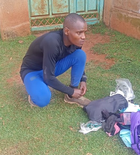 Race walker Dominic Samson Ndigiti packing his belongings after morning training at Manga stadium. He will be competing at this weekend's Athletics Kenya weekend meet at Nyayo stadium