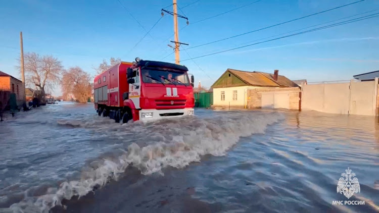 Rescuers drive in a flooded residential area in the city of Orsk, Russia, April 6 2024, in this still image taken from video. Picture: RUSSIAN EMERGENCIES MINISTRY/REUTERS