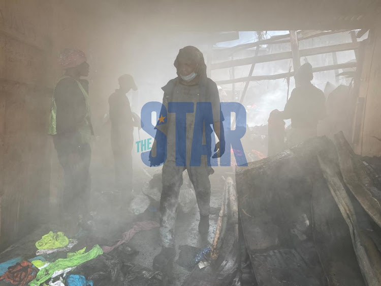 Gikomba traders salvage what is left after a fire on August 6, 2021.