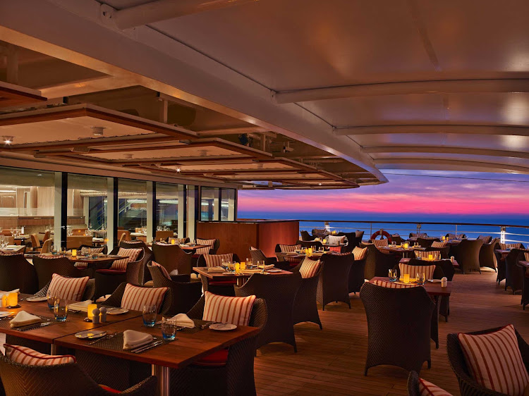 Watch the clouds turn pink at sunset from The Colonnade during your Seabourn Encore sailing. 