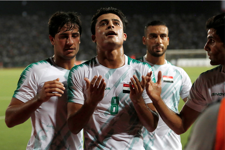 Iraq's Ibrahim Bayesh Al-Kaabawi leads celebrations during a recent match