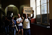 Wits University,  Johannesburg. Police monitored  while a protest by Wits University students was underway.  The police mainly stayed outside  the institution's gates on Wednesday morning.Students were protesting about fee increases along with other matters.Protestors blocked cars from entering or leaving various entrances and exits of the campus causing a traffic jam in the morning and inconveniences later on. Some students also disrupted lectures.  PHOTOGRAPH: ALON SKUY