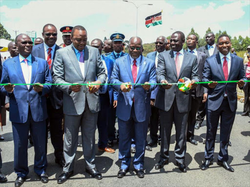 Transport Cabinet Secretary James Macharia, President Uhuru Kenyatta, his Tanzanian counterpart John Magufuli, Deputy President William Ruto and Mining Cabinet Secretary Dan Kazungu during the opening of the Southern Bypass yesterday /PSCU