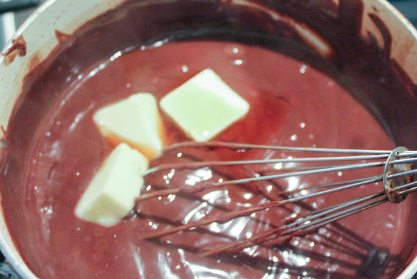 Adding butter and vanilla extract.