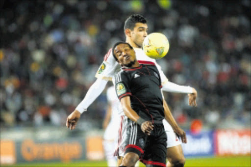 IN CONTROL: Tlou Segolela of Orlando Pirates shields the ball away from Salah Ebrahim of Zamalek during the Caf Champions League match against Zamalek of Egypt at Orlando Stadium PHOTOS: Veli Nhlapo