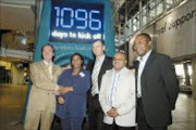 SAY CHEESE: FNB's Derek Carstens, left, and Michael Jordaan, centre, with City of Joburg's Sibongile Mazibuko, Fifa 2010 marketing executive Sandile Ndzekeli and 2010 ambassador Kalusha Bwalya. Pic. Mabuti Kali. 10/06/2007. © Sowetan.