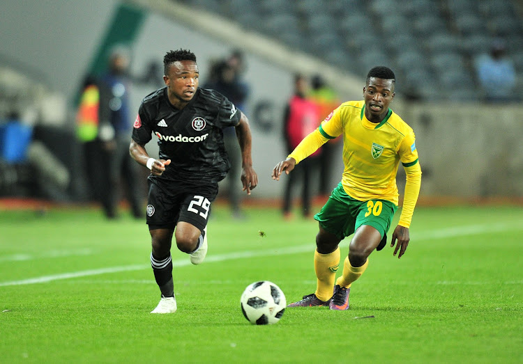 Paseka Mako of Orlando Pirates challenged by Siboniso Conco of Golden Arrows during the Absa Premiership 2018/19 match between Orlando Pirates and Golden Arrows at Orlando Stadium, Johannesburg on 03 October 2018.