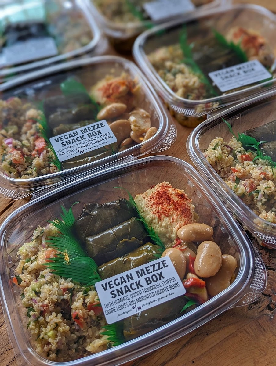 Vegan Mezze Box, includes house-made tabbouleh salad, house-made hummus, stuffed grape leaves, marinated gigandes beans