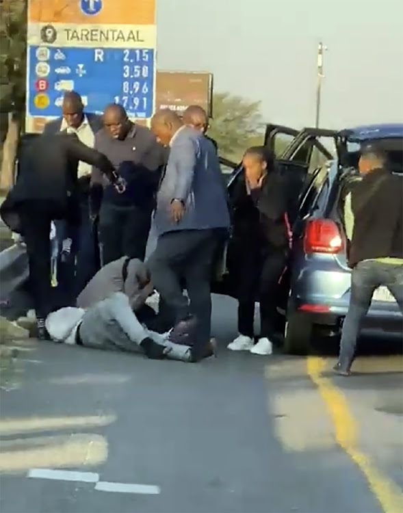 Six members of the VIP protection unit assaulting three men travelling in a VW Polo on the N1 highway.