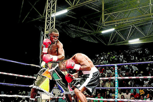 BIG PAYDAY: Xolisani Ndongeni, left, will eventually show his boxing skills beyond the borders of Africa. He has been signed by a US-based company, Banner Promotion PHOTO: SINO