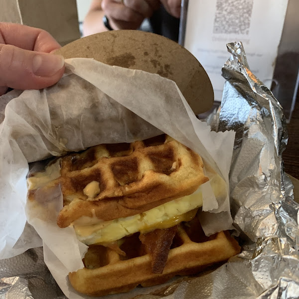 Breakfast sandwich. Gf waffles, egg, cheese, sausage, bacon, spicy mayo