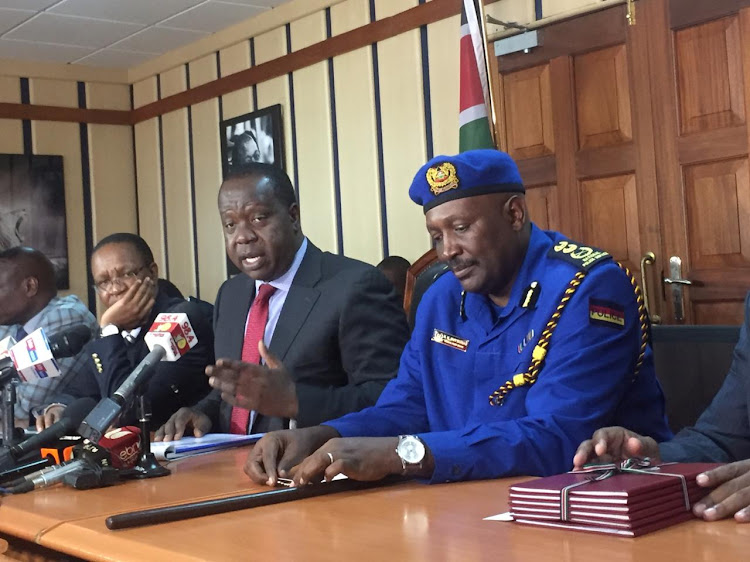 CS Fred Matiang'i addressing the media after receiving the final report on the recently concluded vetting of all civilian gun holders by the Firearms Licensing Board.