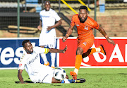 Wits captain Buhle Mkhwanazi tackles Edgar Manaka of Polokwane in yesterday's match.