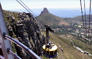 MOUNTAIN HIGH: Cable Town's Table Mountain cable car is being used at night to remove the tons of human waste produced by the thousands of daily visitors. Manager of the cable way John Harrison says the sewerage is piped into tanks and carried to the cable car. 
Pic: Ruvan Boshoff. 
9/11/02. 
© ST.