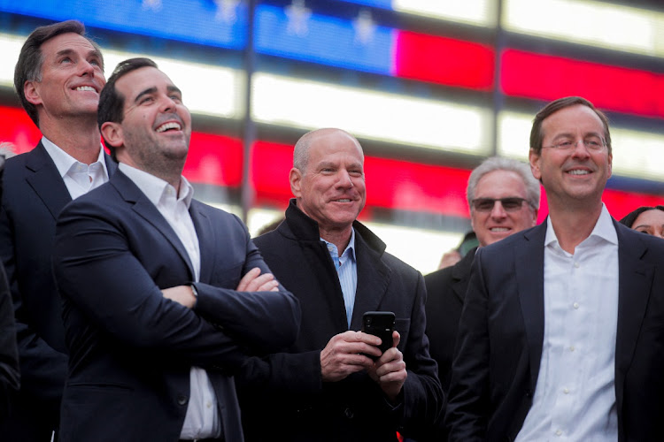 Jon Winkelried, CEO of private equity firm TPG, celebrates his company's IPO outside the Nasdaq Market site in Times Square in New York, the US, January 13 2022. Picture: BRENDAN MCDERMID/REUTERS