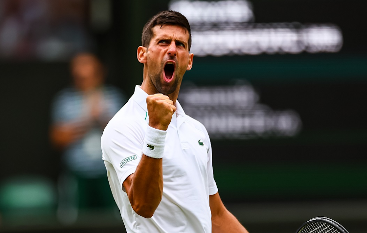 Novak Djokovic of Serbia celebrates his victory over Jannk Sinner of Italy in their Wimbledon Championships quarterfinal at the All England Lawn Tennis and Croquet Club on July 5 2022.