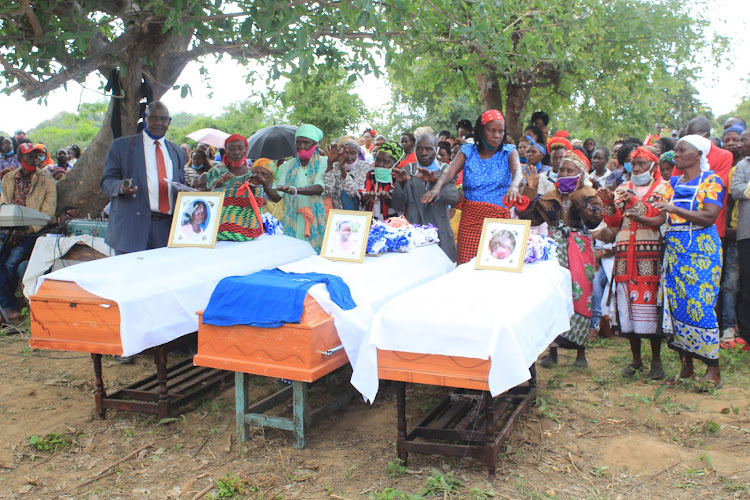 Caskets bearing remains of Rachael Kisungu and her two children at their Kavuvwani village in Mwingi West on Saturday