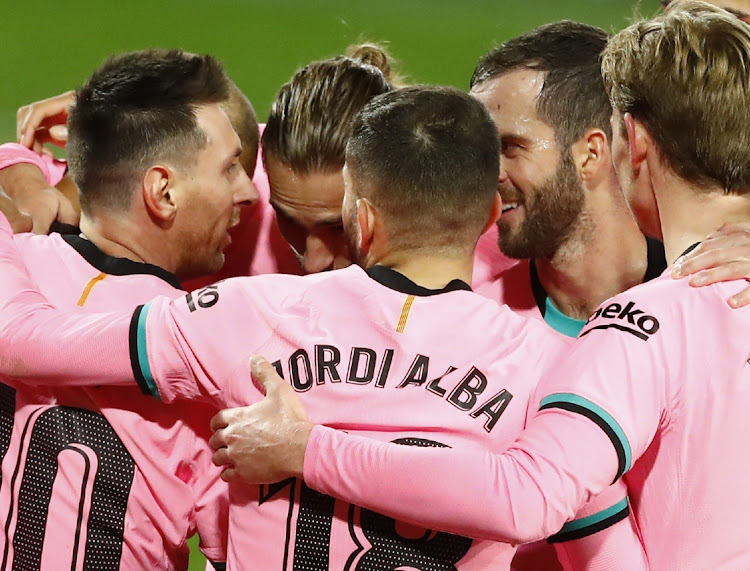 Barcelona's Lionel Messi celebrates scoring with teammates in the La Liga match against Real Valladolid at Estadio Jose Zorrilla, Valladolid, Spain on December 22, 2020