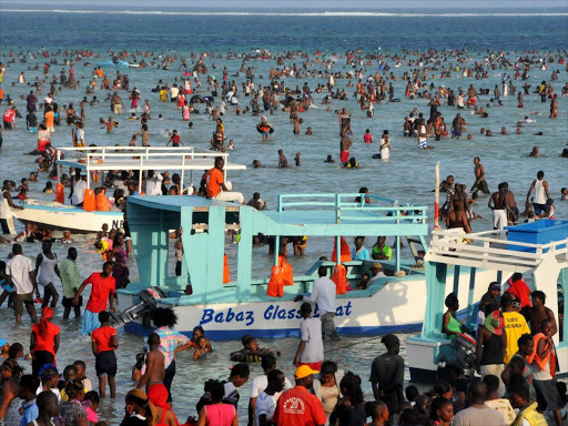 Local tourists at the Jomo Kenyatta public beach in Mombasa. /FILE