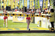 WINNING COMBINATION: Nurgalieva twins Elana and Olesya clinch the women's section of the Comrades Marathon yesterday. Pic. Thuli Dlamini. 30/05/2010. © Sowetan.