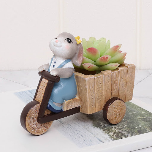 Title 4, Cartoon rabbit flower pot for plants. A charmin...