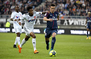  Giovani Lo Celso of PSG, Bongani Zungu of Amiens (left) during the Ligue 1 match between Amiens SC and Paris Saint Germain (PSG) at Stade de la Licorne on May 4, 2018 in Amiens, France. 