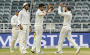  Indian players celebrate with Jasprit Bumrah during day 2 of the 3rd Sunfoil Test match between South Africa and India at Bidvest Wanderers Stadium on January 25, 2018 in Johannesburg, South Africa. 