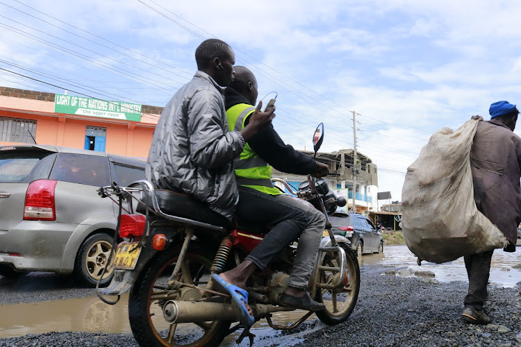 A motorcyclist maneuvers throug flooded section of the newly tarmacked Kincar – Zebra – Airways road in Mavoko, Machakos County on May 6, 2024.