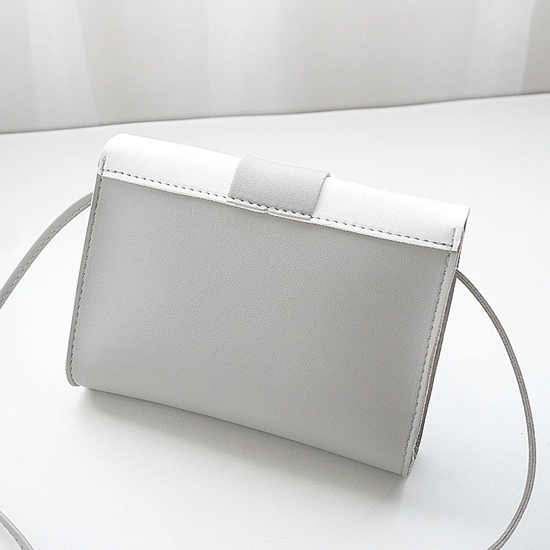 Sac à main pour femmes avec fermeture sécurisée, bandoulière et emplacement pour téléphone portable. Un accessoire élégant et pratique pour toutes vos sorties.