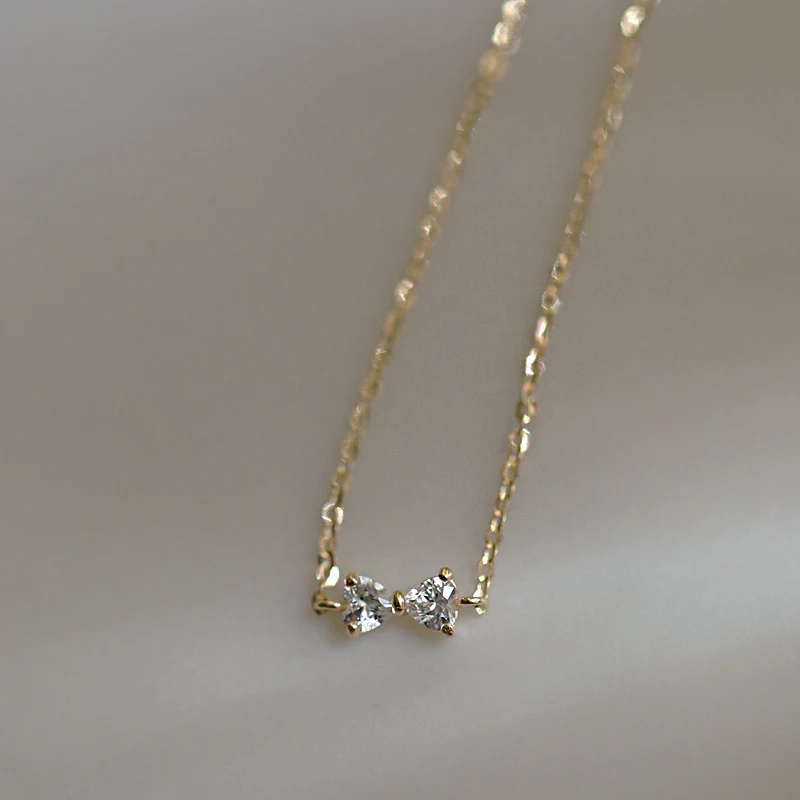 S925 Sterling zilveren strikarmband met hartvormige zirkonia, 14K goud verguld. Een elegant sieraad, perfect als cadeau.
