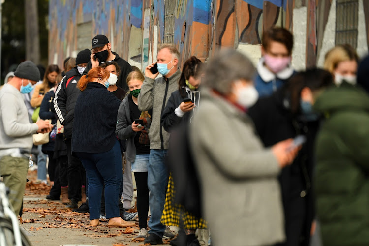 People wait in line to get tested for the coronavirus disease (Covid-19) outside a walk-in testing facility as the city experiences a cluster of new cases in Melbourne, Australia, May 26, 2021.