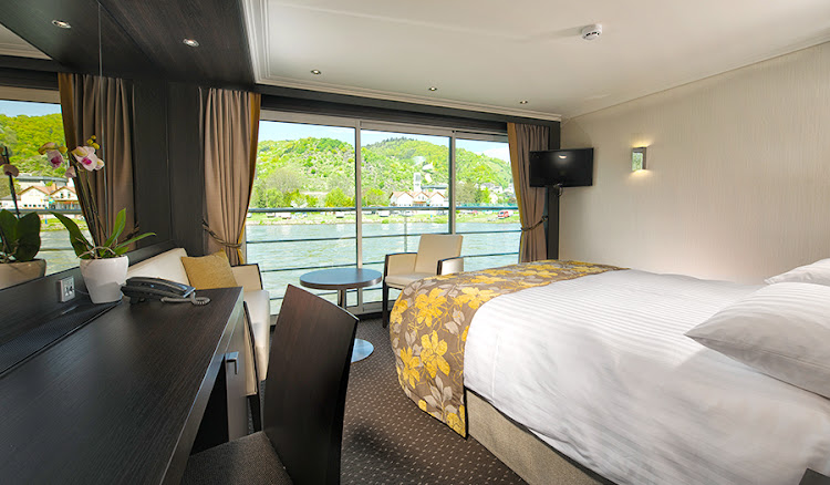 Wake up to a beautiful view of Europe sailing past your suite's French balcony on Avalon Expression.