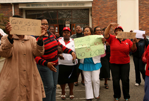 Membes of SATU protesting for higher wages with one poster threatening: "give us our OSD now or no exams". File photo