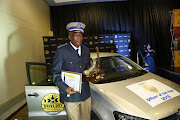 JMPD's top officer of the year, Superintendent Phineas Manyama, with his new car, sponsored by the Drive Dry campaign which focuses on curbing drinking and driving through awareness and increased law enforcement.