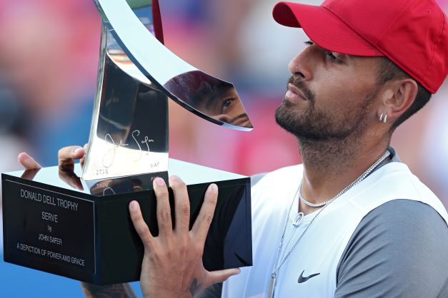 Nick Kyrgios of Australia celebrates with the Donald Dell Trophy after defeating Yoshihito Nishioka of Japan in their men's singles final match during day 9 of the Citi Open at Rock Creek Tennis Center on August 7 2022 in Washington.