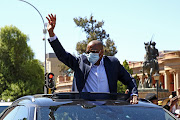 ANC secretary-general Ace Magashule waves to supporters in Bloemfontein where he appeared in court. 