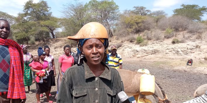 Catherine Mutua and other residents of Nguutani out looking for water.