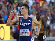 Norway's Jakob Ingebrigtsen crosses the line to win the men's 5,000m final. 