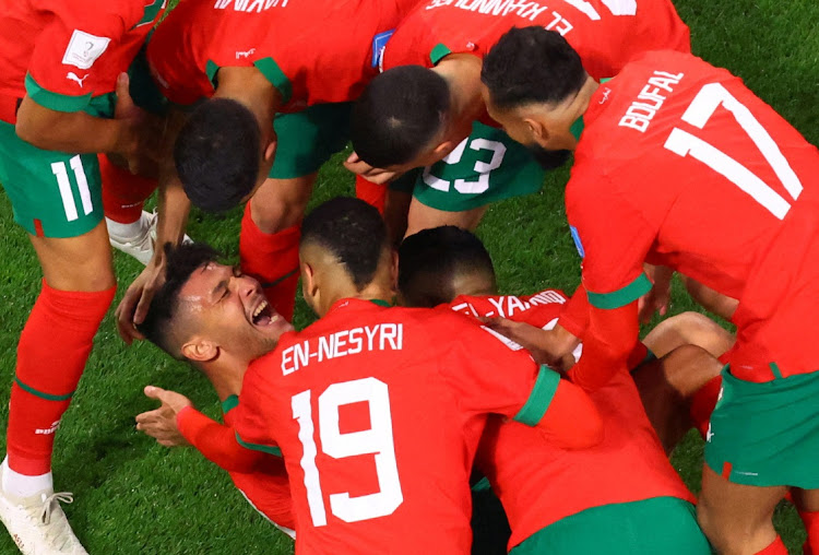 Morocco's Achraf Dari celebrates scoring their goal with Youssef En-Nesyri, Sofiane Boufal and other teammates in their World Cup third-playoff defeat against Croatia at Khalifa International Stadium in Doha, Qatar on December 17 2022.