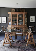 By placing the desk on a rug of its own and away from the wall, an immediate sense of drama and gravitas is created.